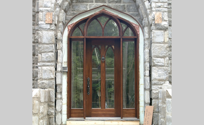 Front door in wooden bourassa